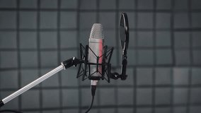 Recording concept. Tracking shot of professional vocal microphone and pop filter for singing or recording a podcast in a bedroom music studio SLIDE RIGHT - Powered by Shutterstock - Get 15% off with code: PIKWIZARD15