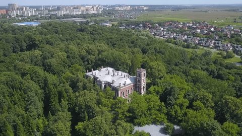 Aerial Drone Pulling Back above Manor Forest