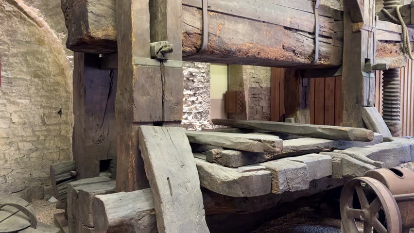 Beaune, France - JANUARY 17, 2025 : An old workshop in Beaune showcasing a variety of tools and equipment used 300 to 400 years ago, highlighting historical craftsmanship and traditional woodworking techniques.