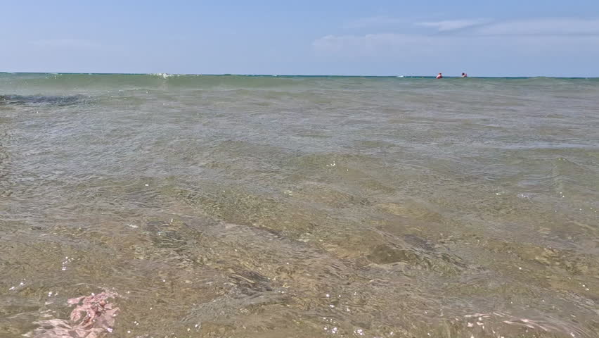 Big Waves Splashing on the Lake. Big waves roll in with views to underwater, showing the clear and pure transparent waters of Lake Michigan. Unspoiled nature located within Wilderness State Park in Northern Michigan, USA.