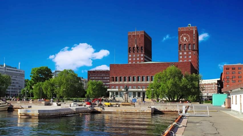 Oslo, Norway - August 11, 2019: Oslo City Hall. It houses the city council. It is the seat of the ceromony of Nobel Peace Prize every year.Oslo , Norway - 09 04 2023: City Hall, View From Promenade by Fjord, People and Building on Golden Hour Sunlightfountain, view, statue, townhall, construction, modern, northern, nordic, sculpture, urban, blue, outdoor, radhuset, fjord, skyline, exterior, harbour, waterfront, outside, port, history, norway, architecture, brick, oslo, landmark, building, travel, radhus, europe, scandinavia, summer, tourism, scandinavian, square, clock, european, town, tower, norwegian, hall, capital, cityscape, town hall, monument, astronomical, water, shore, harbor, harborfront