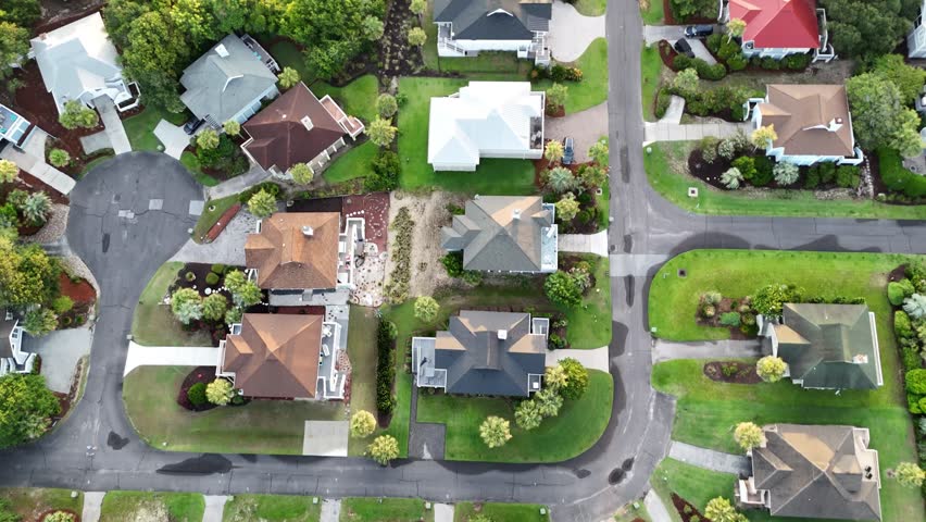 Isle of Palms residential Beach houses in South Carolina USA.  Birdseye drone shot in the morning light. Lush and colorful landscape.