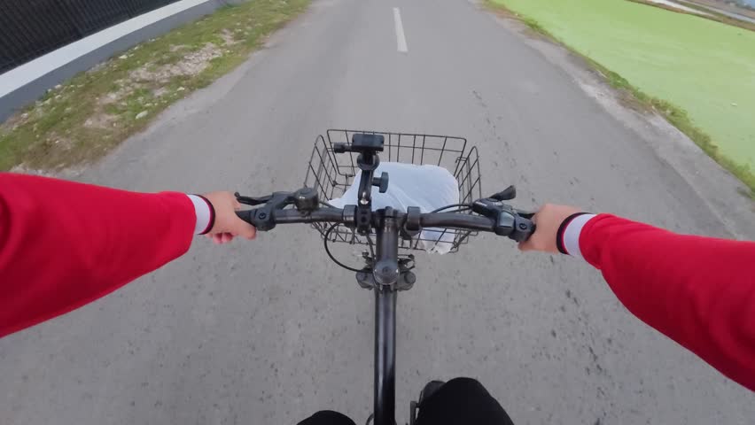 Riding a Bicycle on a Country Road