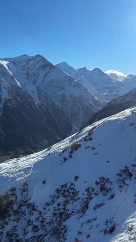 View from the cabin of the lift to the snow-capped mountains