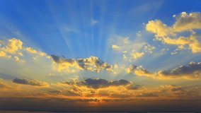 Vibrant golden sky with sunbeams through cumulus clouds at sunrise  - Powered by Shutterstock - Get 15% off with code: PIKWIZARD15