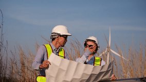 Two engineer working at a wind turbine power generation site. - Powered by Shutterstock - Get 15% off with code: PIKWIZARD15