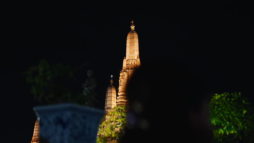 Two asian girls celebrating loy krathong at wat arun