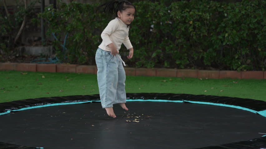 slow motion of child girl jumping on the trampoline