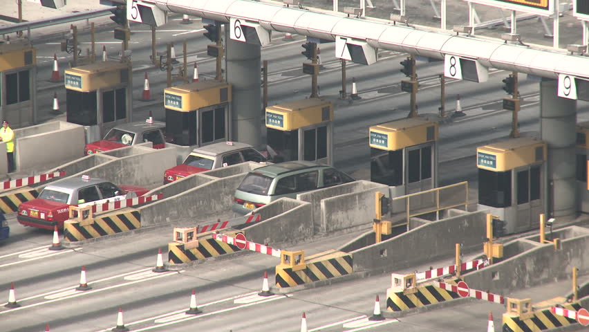 HONG KONG, CHINA - FEBRUARY 2012: Toll Gate Traffic On Highway. Shot in Hong