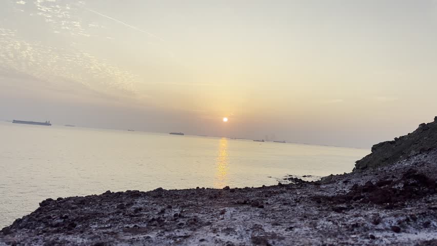 Soft sunrise over calm sea with coastal rocks
Gentle sunrise over a calm sea, soft pastel sky, and rocky shoreline creating a peaceful coastal atmosphere. Perfect for travel, nature, and relaxation themes.