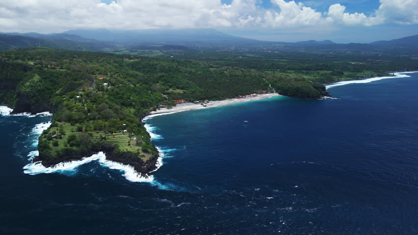 Scenic coastline with tropical beach and green hills