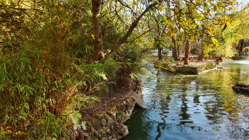The Parque de Maria Luisa, Seville, Andalusia, Spain, expansive lush park with gardens, fountains and monuments
