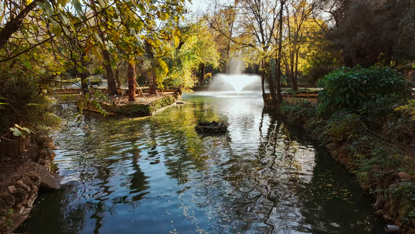 The Parque de Maria Luisa, Seville, Andalusia, Spain, expansive lush park with gardens, fountains and monuments
