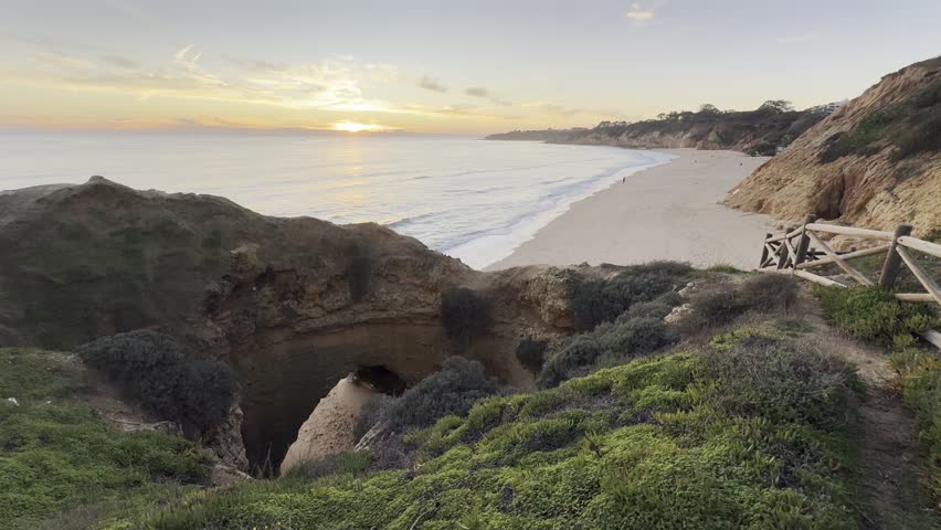View of the sea and rocks of the beach of Olhos de Agua, Albufeira, Algarve, Portugal.