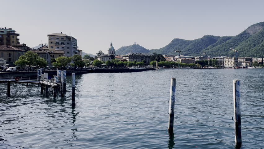 Panoramic view of Lake Como basin and Como city skyline in Italy on sunny day