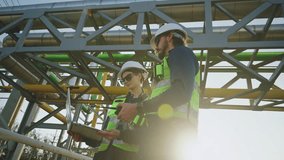 Industrial engineers collaborating on technical project at refinery plant, engineering teamwork, Industrial inspection, modern construction technology, Oil and Gas Petrochemical industry. - Powered by Shutterstock - Get 15% off with code: PIKWIZARD15