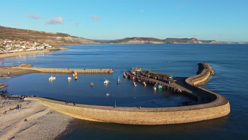 Aerial View of Lyme Regis Town and Harbour at Sunset, Dorset, England