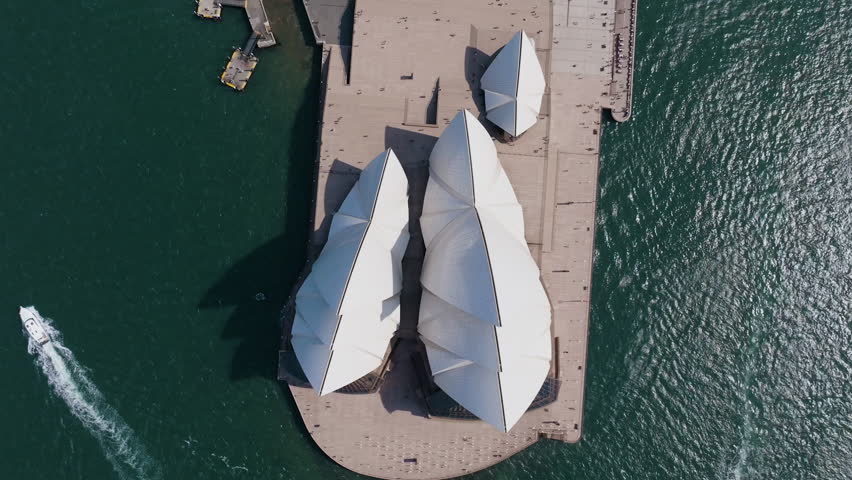 Screwdriver drone shot on top of the Sydney Opera House, sunny day in Australia