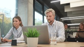 Customer service representatives engaged in professional work using headsets and laptops - Powered by Shutterstock - Get 15% off with code: PIKWIZARD15