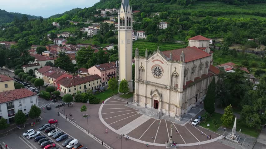 slow rising aerial of Duomo di Santa Maria e San Vitale, Piazza Marconi Guglielmo in Montecchio Maggiore, Italy
