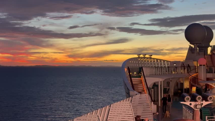 Exploring an empty pool deck on a cruise ship in the evening with lights and seating available