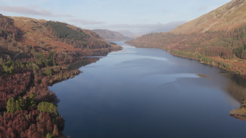 Aerial footage from Thirlmere in the Lake District move forward level between montains. Basic Grade - Prores 422