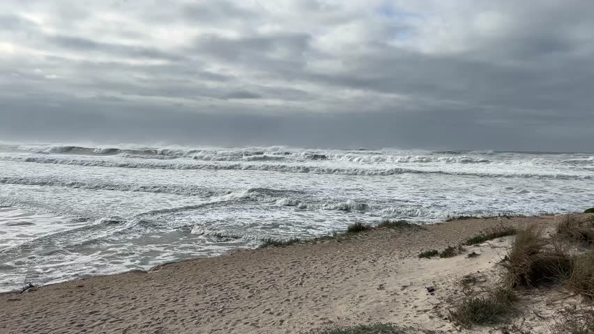 Ominous grey clouds over a turbulent sea