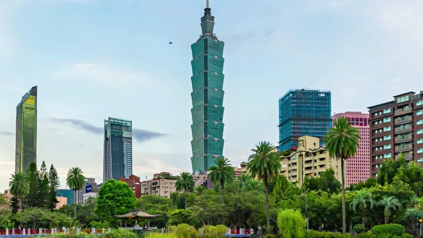 
Beautiful Time lapse Taipei City Sunrise view cityscape of Taiwan at dawn with reflection of the city skyline with the Taipei 101 by a lake in a city park.