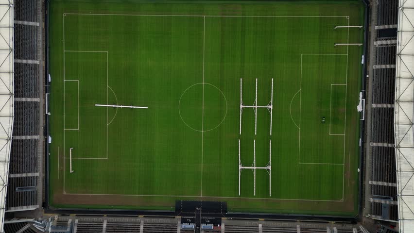 Aerial view of the vibrant green football field at Pride Park Stadium, framed by the stadium