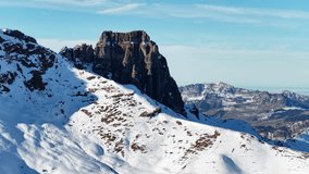 Drone footage of the Churfirsten mountain range with snowy slopes and rugged alpine peaks in Switzerland. - Powered by Shutterstock - Get 15% off with code: PIKWIZARD15