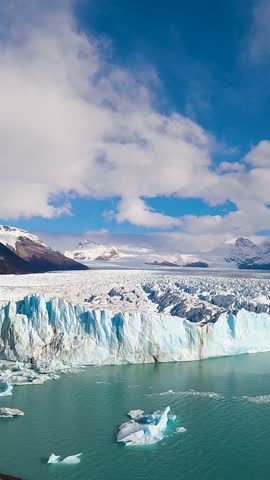 Los Glaciares National Park In El Calafate Santa Cruz Argentina. Stunning View Of Icebergs Breaking Off Into The Water . Snowing Day Tourism Glacial Landscape Frozen. Snowing Day Glacier.