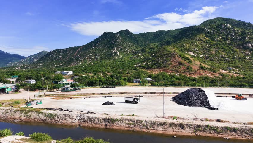 Aerial View Pan of the Truck and the Salt Hill at the Salt Farm.