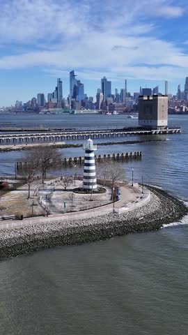 Lighthouse Point In Jersey City New Jersey United States. Aerial View Of A Bustling Ligthhouse In A Coast City. Town Clouds Sky Backgrounds Urban. Outside Backgrounds Panning Wide.
