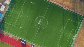 Top down drone footage descending over football field, suitable for sports analysis and data visualization concepts - Powered by Shutterstock - Get 15% off with code: PIKWIZARD15