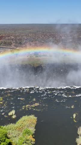 Scenic Water Fall In Victoria Falls Matabeleland North Zimbabwe. Powerful Waterfall Cascading Over Rocky Cliff Into Mist. Recreation Falls Flowing Beautiful. Recreation Travel Nature.