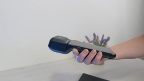 Slow motion mobile phone contactless payment using NFC technology on modern POS terminal - Powered by Shutterstock - Get 15% off with code: PIKWIZARD15