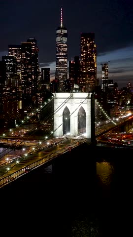 Brooklyn Bridge In Manhattan New York United States. Stunning Landscape Of Highway Road Viewed From Above. Night Highway Road Downtown Cityscape. Night Panning Wide. Cities Of The World.