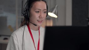 Asian woman IT wearing a headset while support agent performing troubleshooting and software diagnostics to provide immediate digital solutions for corporate clients - Powered by Shutterstock - Get 15% off with code: PIKWIZARD15