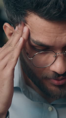 Frustrated anxious worried Indian businessman problem with mobile phone technology Arabian business man furious stress troubled smartphone app notification bank reject at cafe shock employer indoor