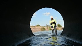 Engineer Conducting Safety Inspection at Drainage Pipe and Water Channel - Powered by Shutterstock - Get 15% off with code: PIKWIZARD15