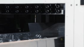 Plastic bottle preforms. Making of Transparent PET plastic preforms move along automated conveyor belt in factory. Industrial production line concept for plastic bottle packaging automation recycling - Powered by Shutterstock - Get 15% off with code: PIKWIZARD15