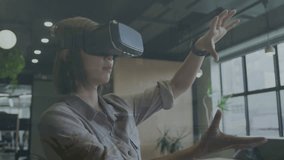 Animation of data processing with icons over caucasian businesswoman using vr headset at office. Global business, computing and digital interface concept digitally generated video - Powered by Shutterstock - Get 15% off with code: PIKWIZARD15