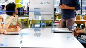 Animation of statistical data processing over man giving a presentation at office. Computer interface and business data technology concept - Powered by Shutterstock - Get 15% off with code: PIKWIZARD15