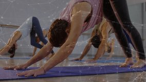 Group of adults performing downward-facing dog in fitness studio with animated data network overlay. Fitness, wellness, yoga, group exercise, active lifestyle, mindfulness, fitness class - Powered by Shutterstock - Get 15% off with code: PIKWIZARD15
