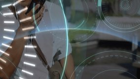 Animation of financial data processing over caucasian businessman using smartphone. Global business, finance, computing and data processing concept digitally generated video. - Powered by Shutterstock - Get 15% off with code: PIKWIZARD15