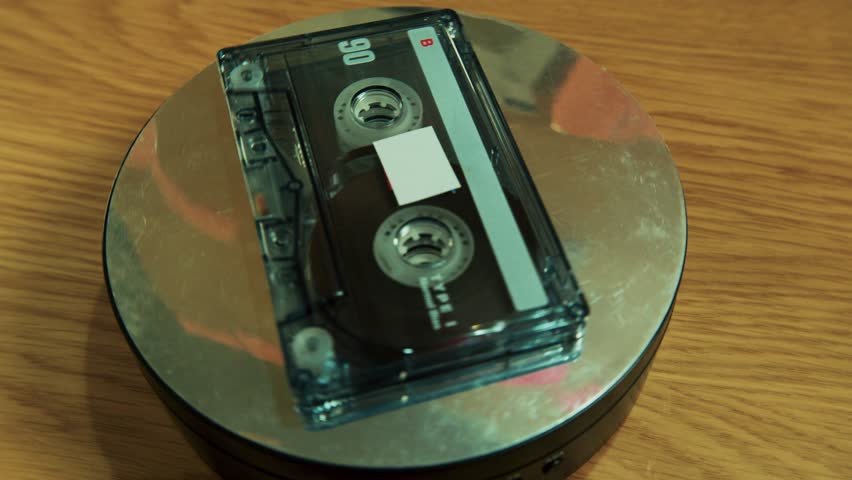 Macro view of classic audio cassette rotating smoothly