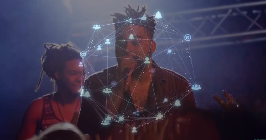 Performing duo stepping on concert stage, gripping microphone and animating network graphic overlay. Live performance, musical expression, vibrant lighting, stage environment, contemporary music,