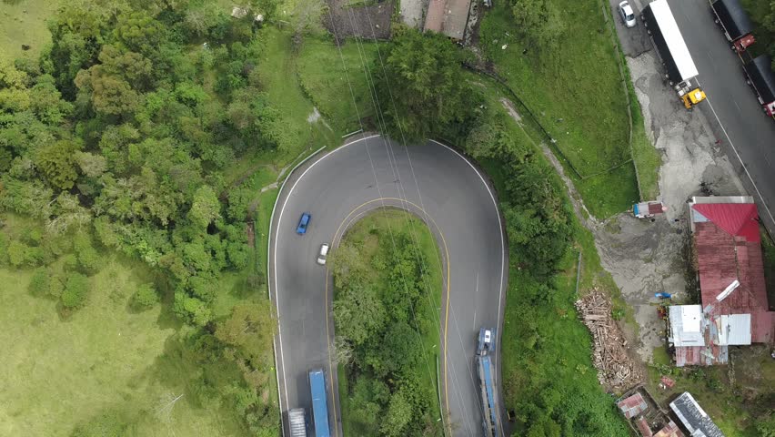 road over the Andes mountain range with its mountains and fog