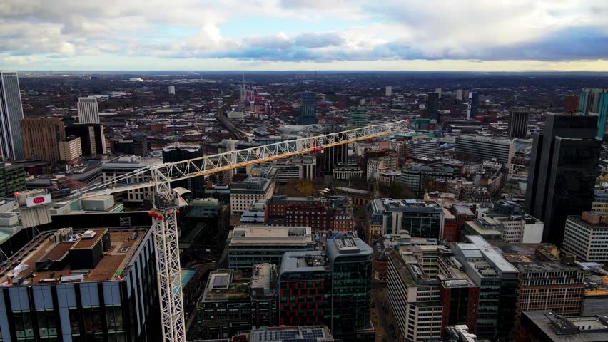 Urban development with high crane in Birmingham city skyline