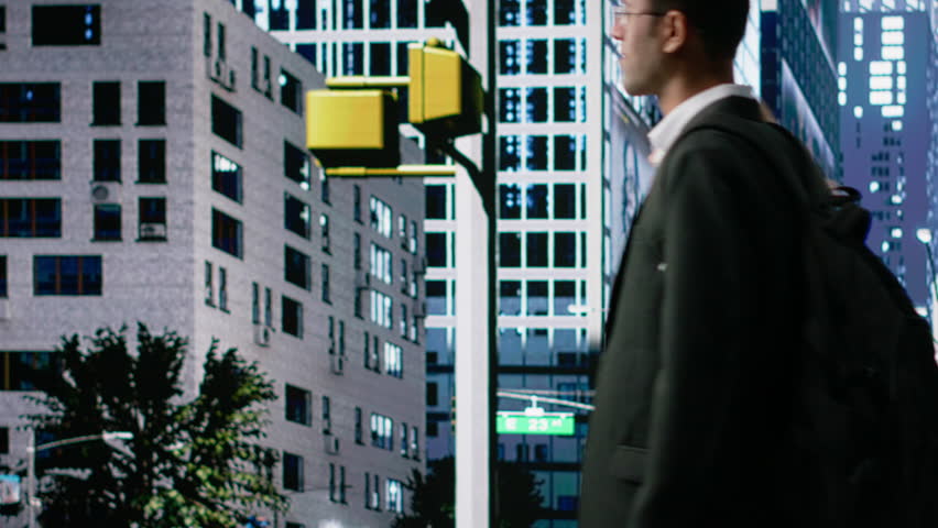 Dynamic urban crowd of diverse people at the intersection crossing busy street, highlighting multicultural street people engaged in everyday activity and vibrant city motion. Camera B.